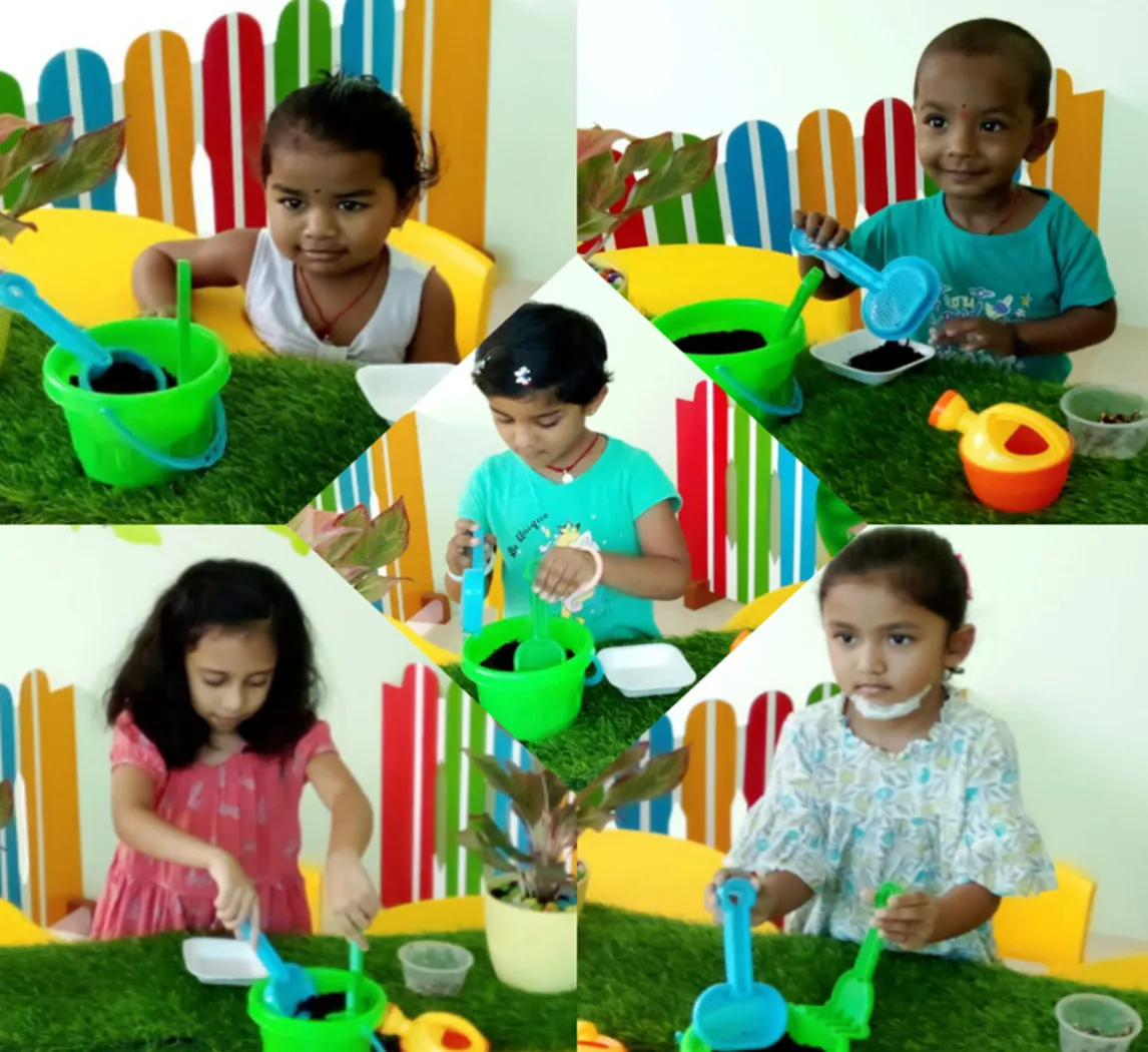 Children at the sand and water play station